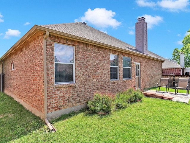 1928 Juniper Dr, Little Elm, TX 75068 - view of side of home with brick siding, a chimney, a wooden deck, and roof with shingles