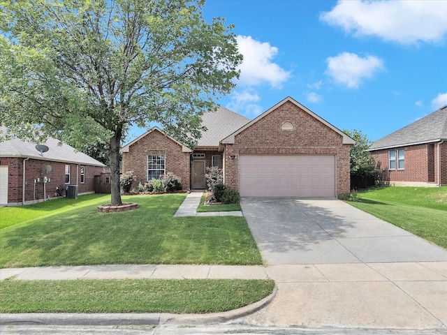 1928 Juniper Dr, Little Elm, TX 75068 - view of front facade featuring brick siding, a garage, and a front yard