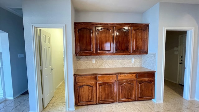 7811 Corona Ct, Arlington, TX 76002 - kitchen with backsplash and light tile patterned floors