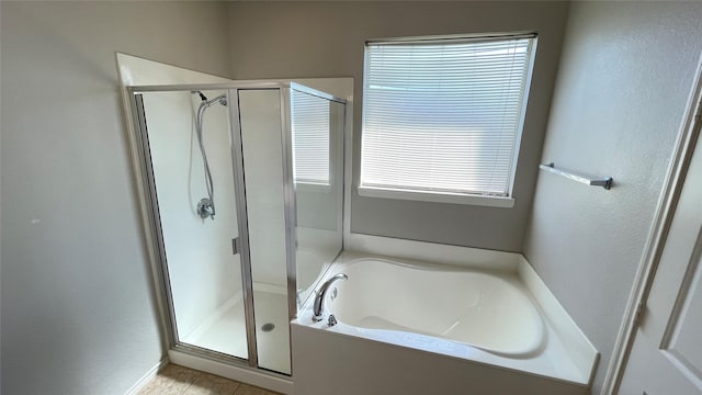 7811 Corona Ct, Arlington, TX 76002 - full bath featuring a stall shower, a garden tub, plenty of natural light, and tile patterned flooring