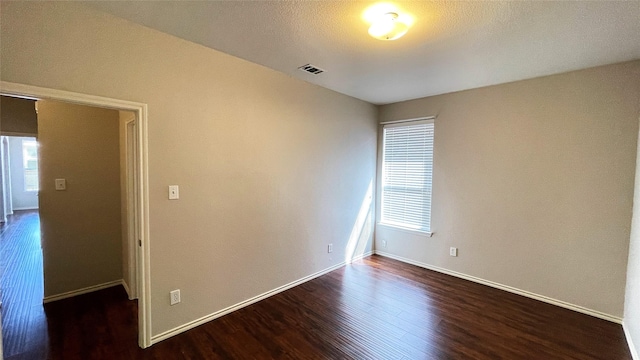 7811 Corona Ct, Arlington, TX 76002 - empty room with dark wood-type flooring and baseboards