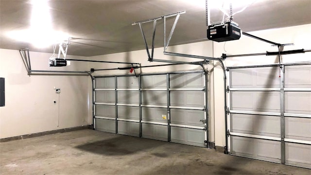 7811 Corona Ct, Arlington, TX 76002 - garage featuring a garage door opener and electric panel