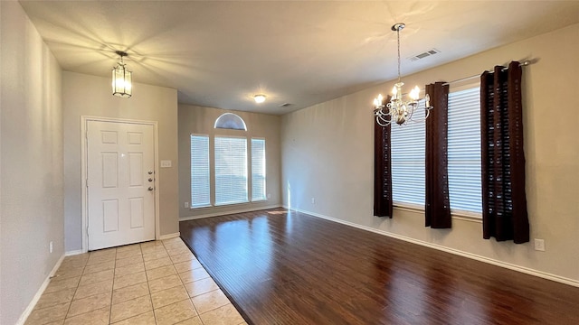 7811 Corona Ct, Arlington, TX 76002 - entryway with a chandelier and light tile patterned floors