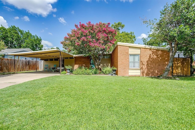 4913 Rutland Ave, Fort Worth, TX 76133 - mid-century home with concrete driveway, a carport, and brick siding