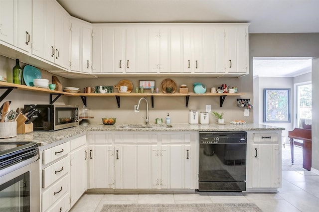 4913 Rutland Ave, Fort Worth, TX 76133 - kitchen featuring appliances with stainless steel finishes, open shelves, light tile patterned flooring, and white cabinetry
