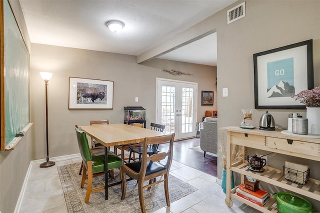 4913 Rutland Ave, Fort Worth, TX 76133 - dining space featuring french doors, light tile patterned floors, and beamed ceiling