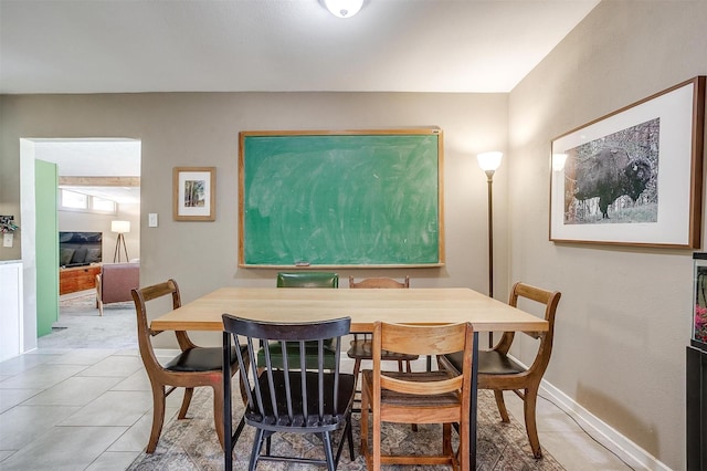 4913 Rutland Ave, Fort Worth, TX 76133 - dining room featuring light tile patterned floors and baseboards
