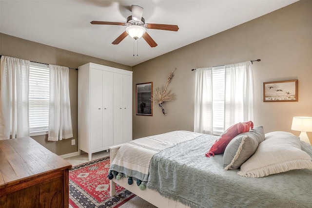 4913 Rutland Ave, Fort Worth, TX 76133 - carpeted bedroom with multiple windows, a closet, and ceiling fan