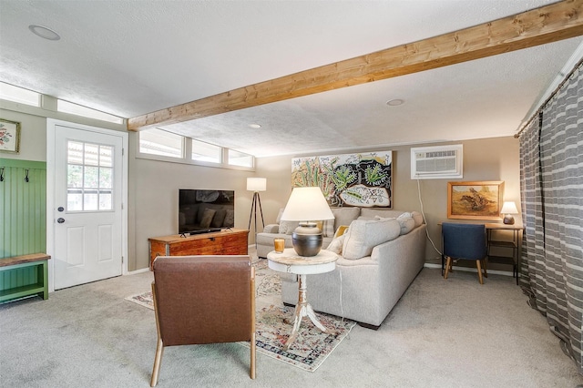 4913 Rutland Ave, Fort Worth, TX 76133 - carpeted living area featuring a wall mounted AC, beam ceiling, and a textured ceiling