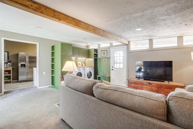 4913 Rutland Ave, Fort Worth, TX 76133 - living area featuring washer and dryer, light colored carpet, a textured ceiling, and beam ceiling