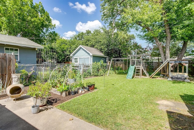 4913 Rutland Ave, Fort Worth, TX 76133 - fenced backyard featuring a garden and a playground