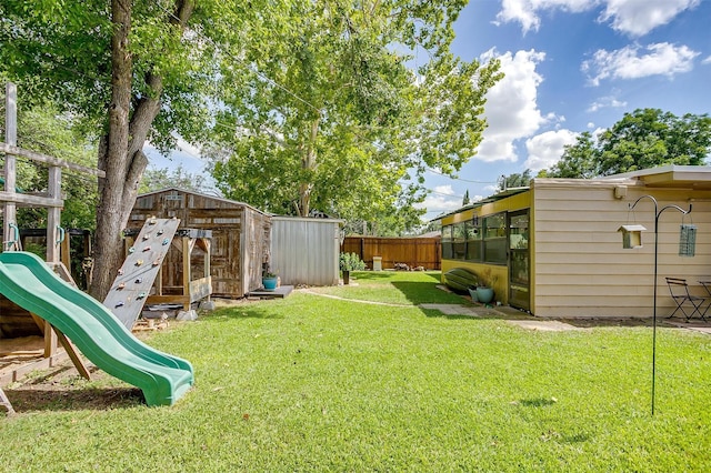 4913 Rutland Ave, Fort Worth, TX 76133 - fenced backyard featuring a playground and a storage shed
