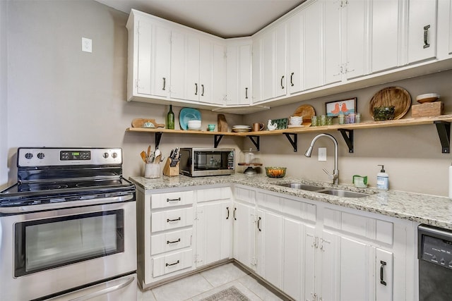 4913 Rutland Ave, Fort Worth, TX 76133 - kitchen featuring stainless steel appliances, open shelves, light tile patterned flooring, and white cabinets