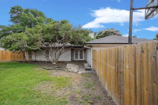2709 S Hillbrier Cir, Plano, TX 75075 - fenced backyard featuring french doors