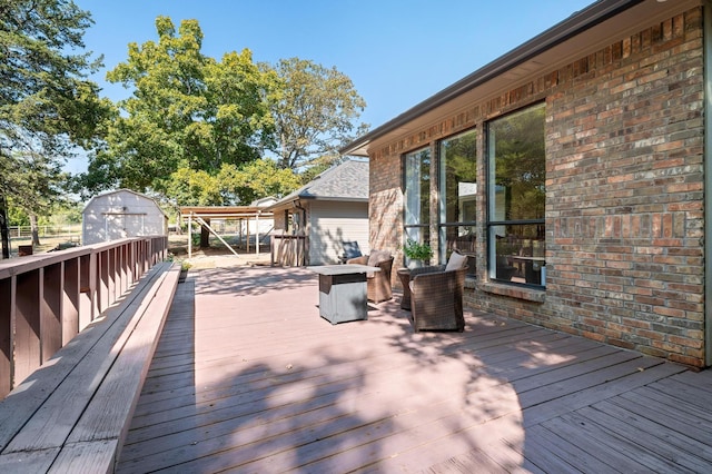 143 Shady Woods Ln, Denison, TX 75021 - wooden terrace featuring a storage shed
