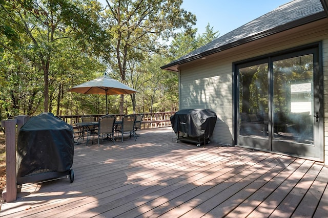 143 Shady Woods Ln, Denison, TX 75021 - wooden terrace with outdoor dining space and grilling area