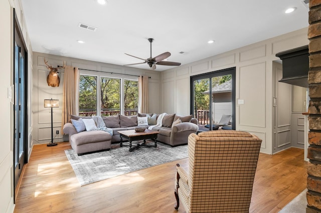 143 Shady Woods Ln, Denison, TX 75021 - living area with a decorative wall, a ceiling fan, light wood-style flooring, and recessed lighting