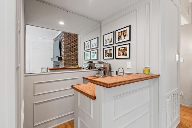 143 Shady Woods Ln, Denison, TX 75021 - bar featuring light wood-style floors and recessed lighting