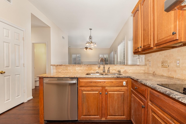 2248 Amy Ln, Plano, TX 75074 - kitchen with stainless steel dishwasher, a chandelier, decorative backsplash, light stone countertops, and dark wood-type flooring