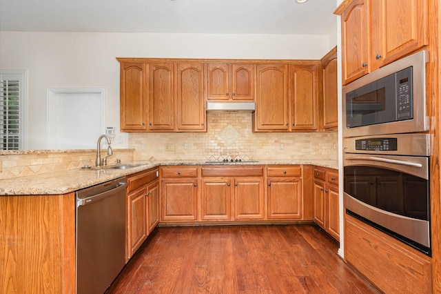 2248 Amy Ln, Plano, TX 75074 - kitchen with stainless steel appliances, light stone countertops, decorative backsplash, and dark wood-style floors
