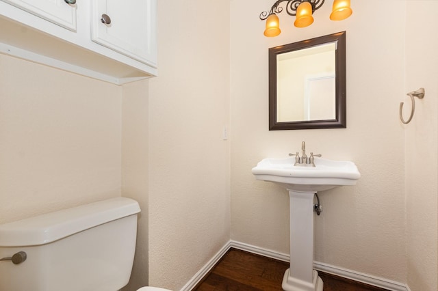 2248 Amy Ln, Plano, TX 75074 - half bathroom with wood finished floors and toilet