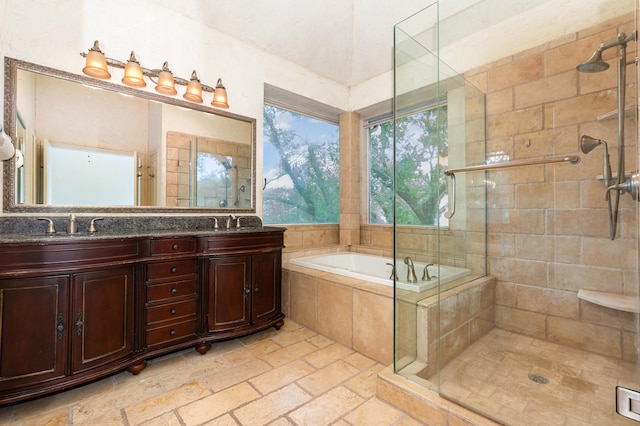 2248 Amy Ln, Plano, TX 75074 - bathroom featuring a bath, a stall shower, double vanity, and stone tile floors