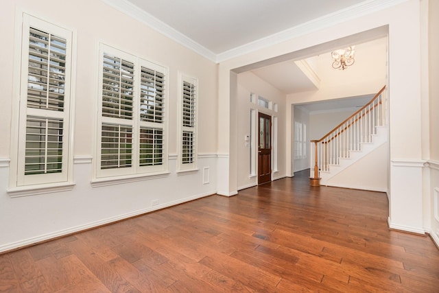 2248 Amy Ln, Plano, TX 75074 - entrance foyer featuring wood finished floors, a chandelier, ornamental molding, and stairs