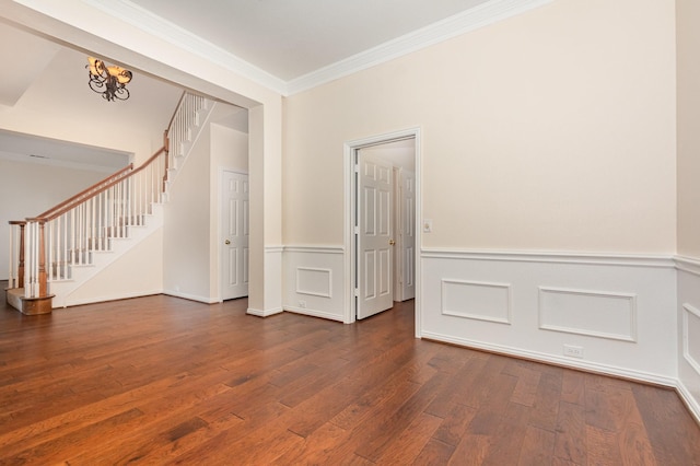 2248 Amy Ln, Plano, TX 75074 - unfurnished room with dark wood-style floors, crown molding, stairs, a wainscoted wall, and a chandelier