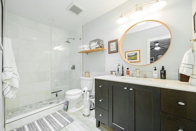 325 Los Santos Dr, Garland, TX 75043 - bathroom with vanity, tiled shower, wood finished floors, and a ceiling fan