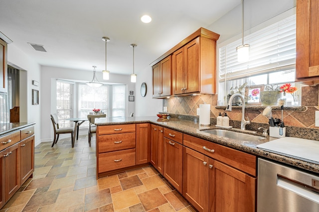325 Los Santos Dr, Garland, TX 75043 - kitchen featuring dishwasher, tasteful backsplash, brown cabinets, a peninsula, and recessed lighting
