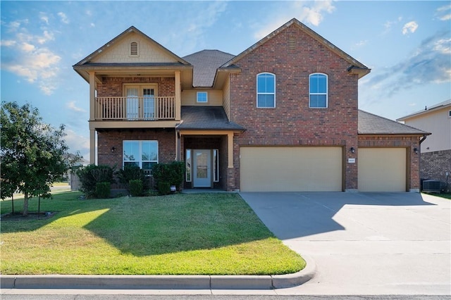 6600 Cascade Dr, Waco, TX 76712 - craftsman-style house featuring brick siding, a front yard, driveway, a balcony, and a garage