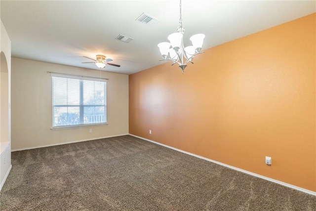 6600 Cascade Dr, Waco, TX 76712 - unfurnished room with dark colored carpet, ceiling fan, a chandelier, and arched walkways