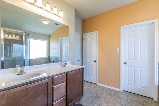 6600 Cascade Dr, Waco, TX 76712 - bathroom featuring double vanity, a stall shower, and tile patterned flooring
