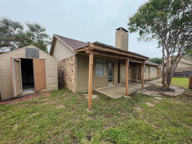 820 Via Madonna, Mesquite, TX 75150 - rear view of house with a chimney, a patio, a shed, and brick siding