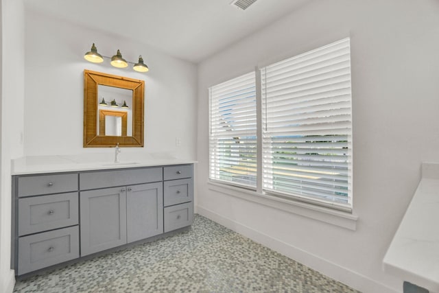 301 E Wall St, Grapevine, TX 76051 - bathroom with baseboards and vanity