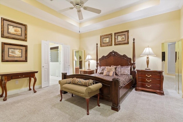 1313 Windstone Dr, Waco, TX 76712 - bedroom with light carpet, crown molding, connected bathroom, a tray ceiling, and ceiling fan