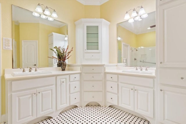 1313 Windstone Dr, Waco, TX 76712 - full bathroom featuring double vanity, ornamental molding, and a shower with shower door