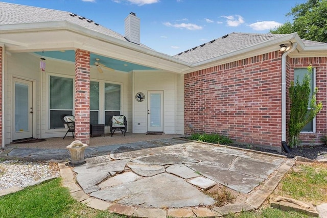 1313 Windstone Dr, Waco, TX 76712 - property entrance featuring a patio area, brick siding, a chimney, and a shingled roof