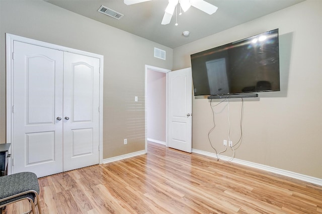 1201 Claire Ct, Burleson, TX 76028 - unfurnished bedroom with light wood finished floors, a closet, and ceiling fan