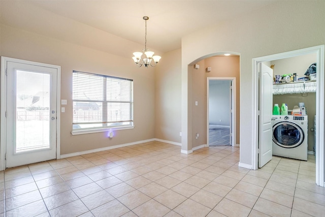 1201 Claire Ct, Burleson, TX 76028 - unfurnished dining area with washer / clothes dryer, arched walkways, a chandelier, light tile patterned floors, and vaulted ceiling