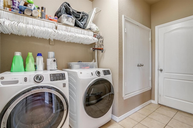 1201 Claire Ct, Burleson, TX 76028 - laundry room with light tile patterned flooring and washer and clothes dryer