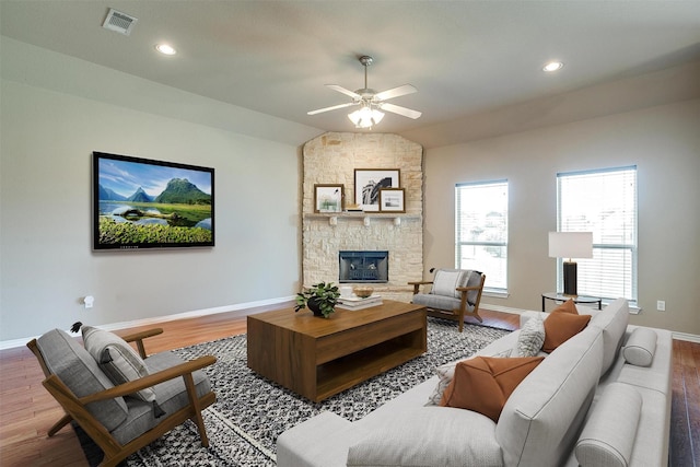 1201 Claire Ct, Burleson, TX 76028 - living area featuring wood finished floors, a ceiling fan, a stone fireplace, lofted ceiling, and recessed lighting