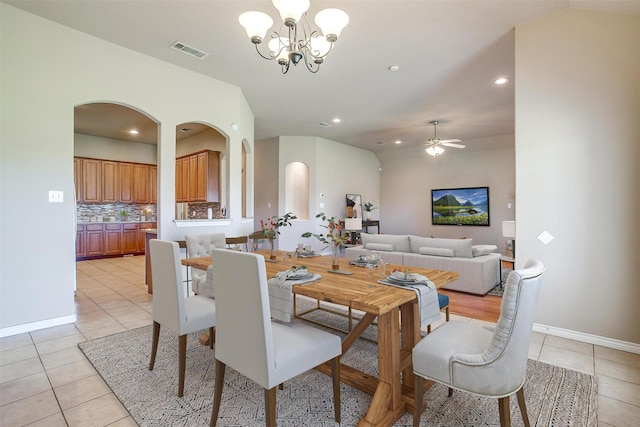 1201 Claire Ct, Burleson, TX 76028 - dining space featuring light tile patterned floors, arched walkways, a chandelier, a ceiling fan, and recessed lighting