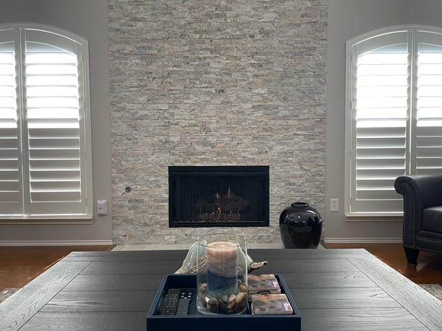 1409 Creekview Dr, Lewisville, TX 75067 - detailed view of a fireplace and wood finished floors