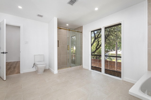 4942 Thunder Rd, Dallas, TX 75244 - bathroom with a stall shower, recessed lighting, and a tub to relax in