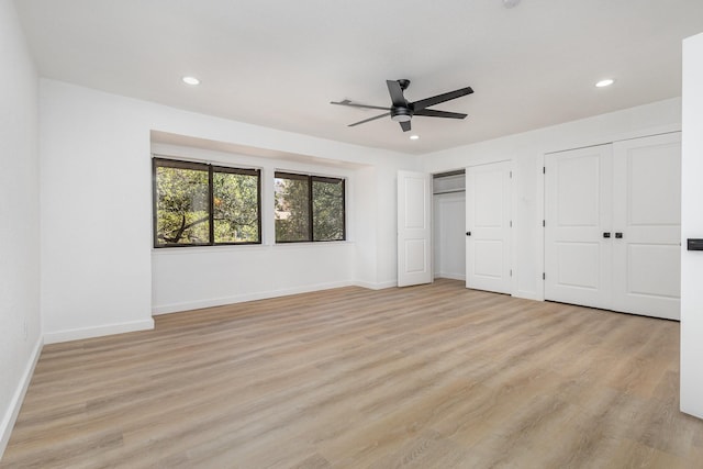 4942 Thunder Rd, Dallas, TX 75244 - unfurnished bedroom featuring two closets, light wood-style floors, recessed lighting, and ceiling fan