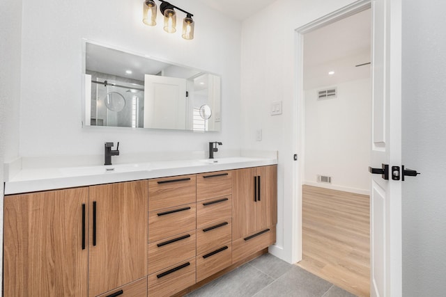 4942 Thunder Rd, Dallas, TX 75244 - full bath with double vanity, tile patterned floors, and a shower stall