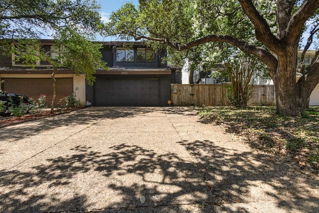 4942 Thunder Rd, Dallas, TX 75244 - view of property exterior featuring an attached garage, concrete driveway, and stucco siding