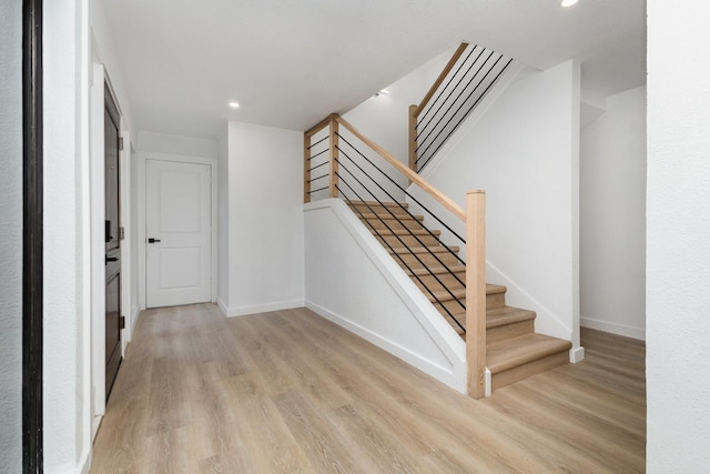 4942 Thunder Rd, Dallas, TX 75244 - stairs featuring wood finished floors and recessed lighting