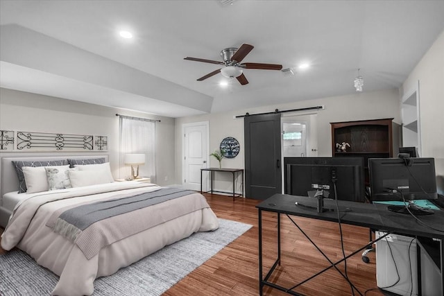 612 W Park Ave, Weatherford, TX 76086 - bedroom with a barn door, wood finished floors, a desk, a ceiling fan, and recessed lighting